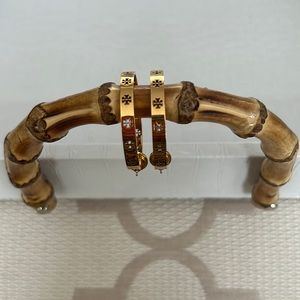 Tory Burch gold tone hoop earrings. Never worn, excellent condition.